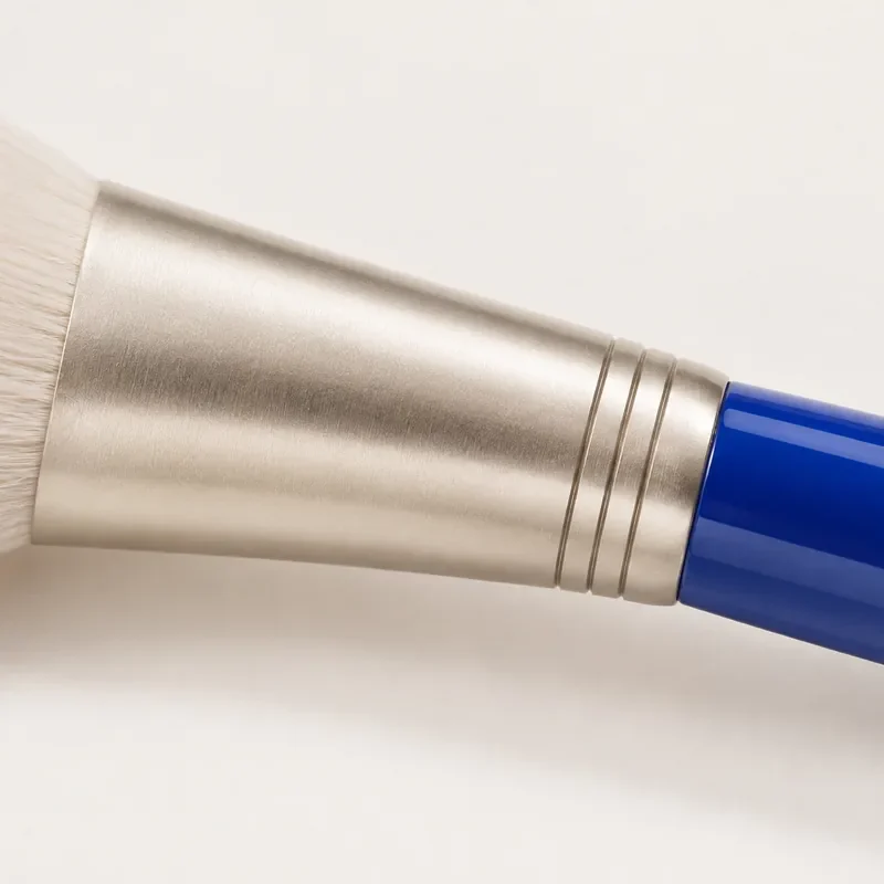 Close-up of a brushed aluminium ferrule on a cobalt handle